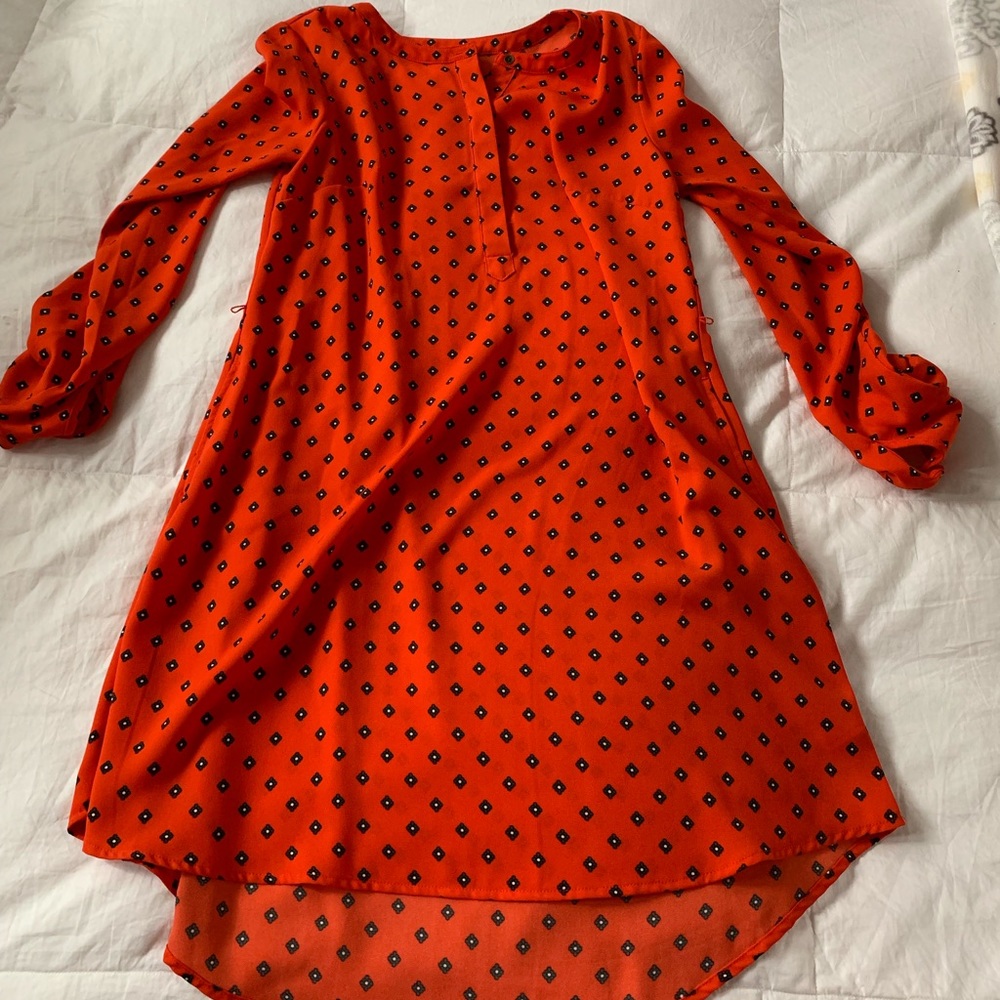 Orange dress with diamond-shaped teal print